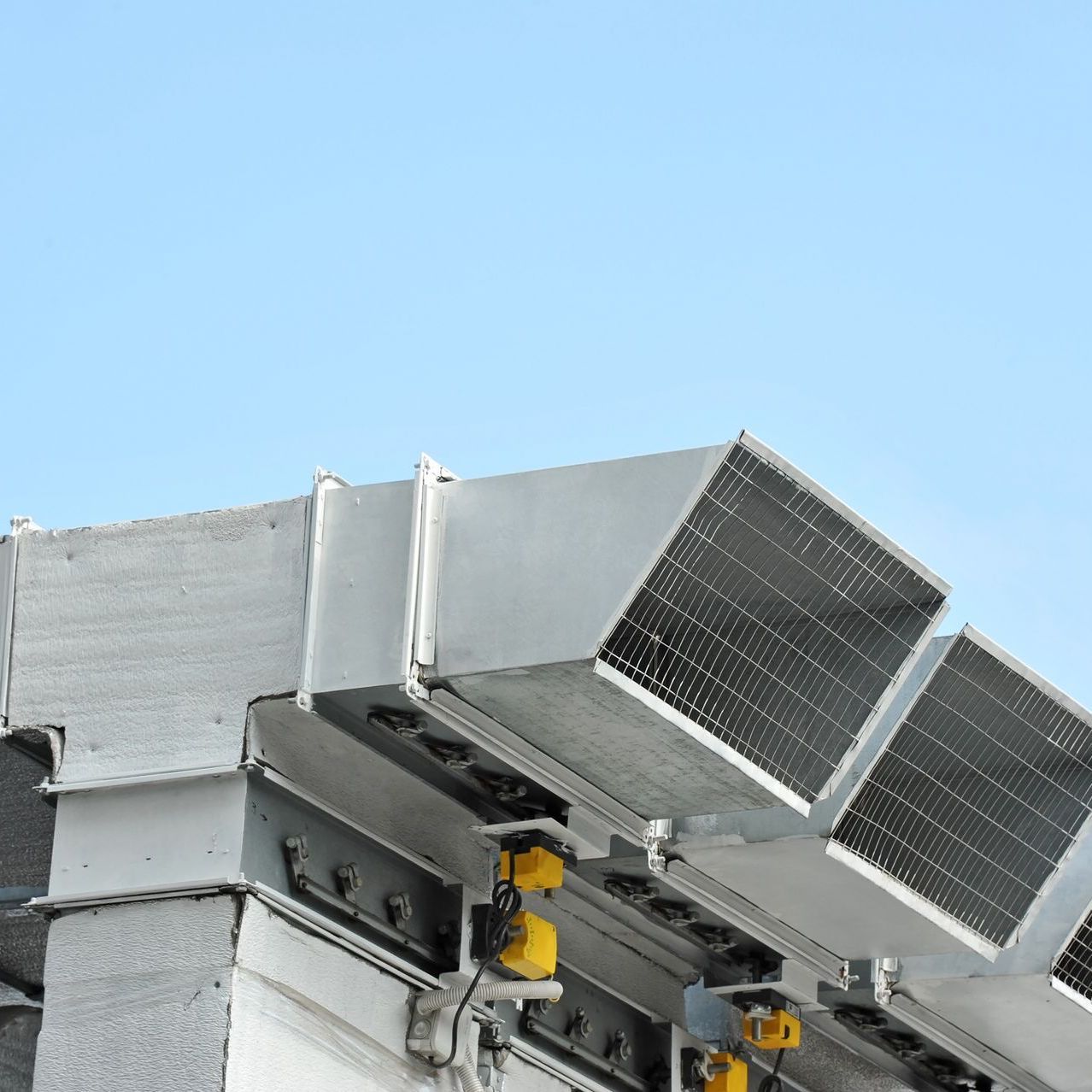 A close up of a building with a blue sky in the background