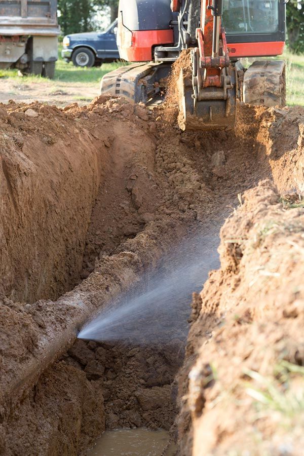 A Large Pipe Is Coming Out Of A Hole In The Ground — Tweed Heads Leak Detection in Casuarina, NSW