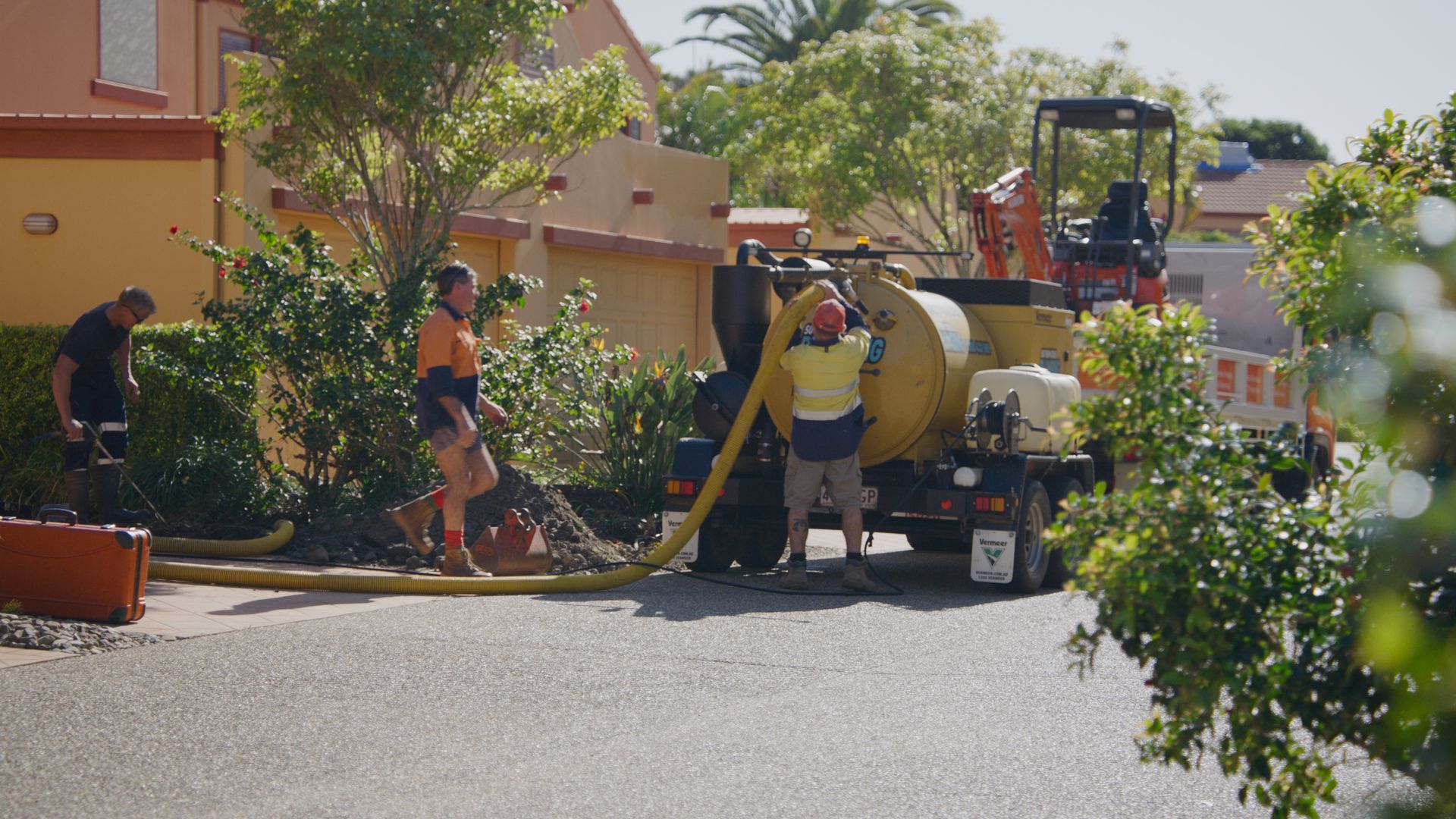 A Person Is Holding An Orange Device With The Number 108 On The Screen — Tweed Heads Leak Detection in Chinderah, NSW