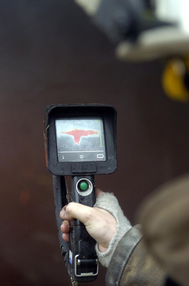 A Person Is Holding A Camera In Their Hand — Tweed Heads Leak Detection in Banora Point, NSW