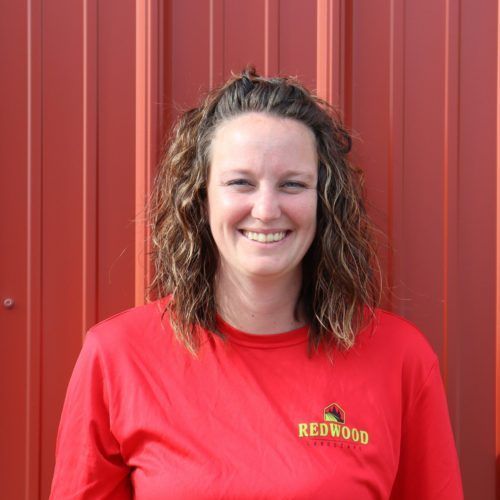 A woman in a red shirt Redwood Landscape employee Cedar Lake Indiana