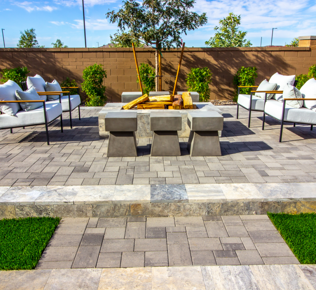 There is a fire pit in the middle of the patio.