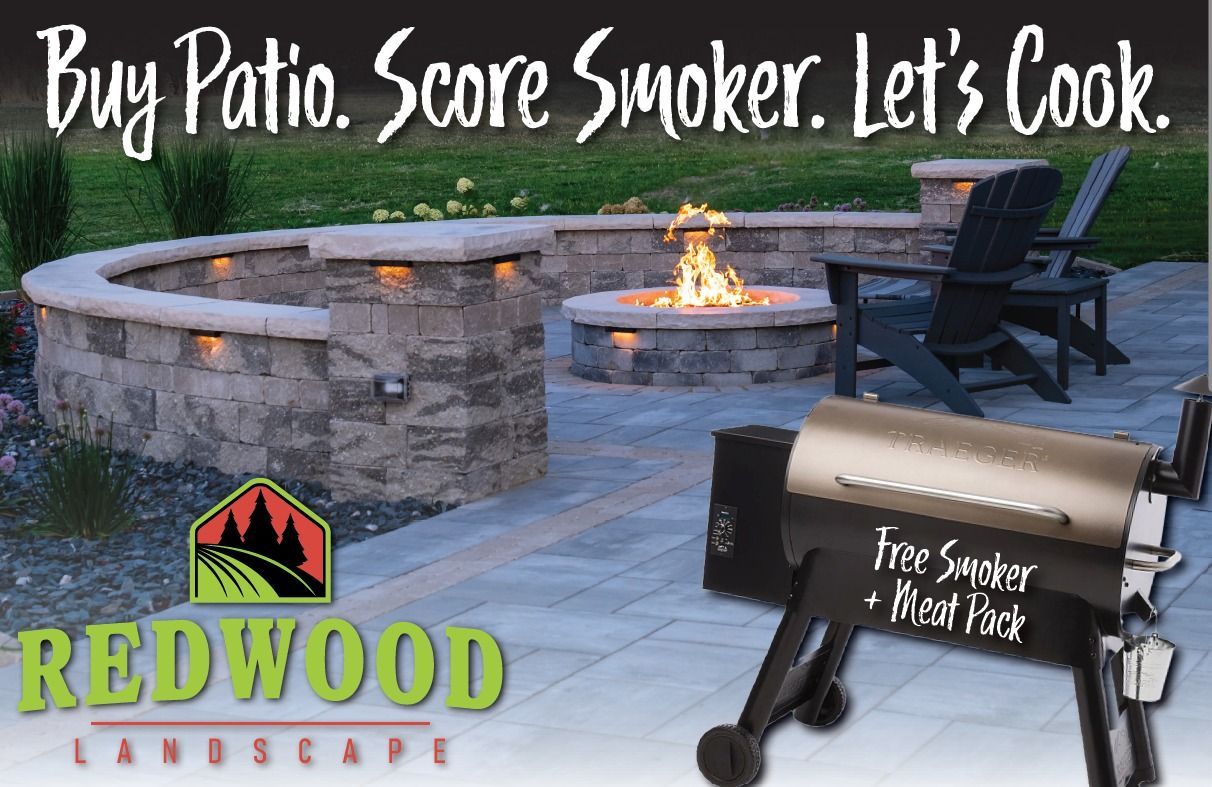 Redwood Landscape patio with built-in firepit and grill, featuring a Traeger wood pellet smoker and premium meat pack giveaway promotion