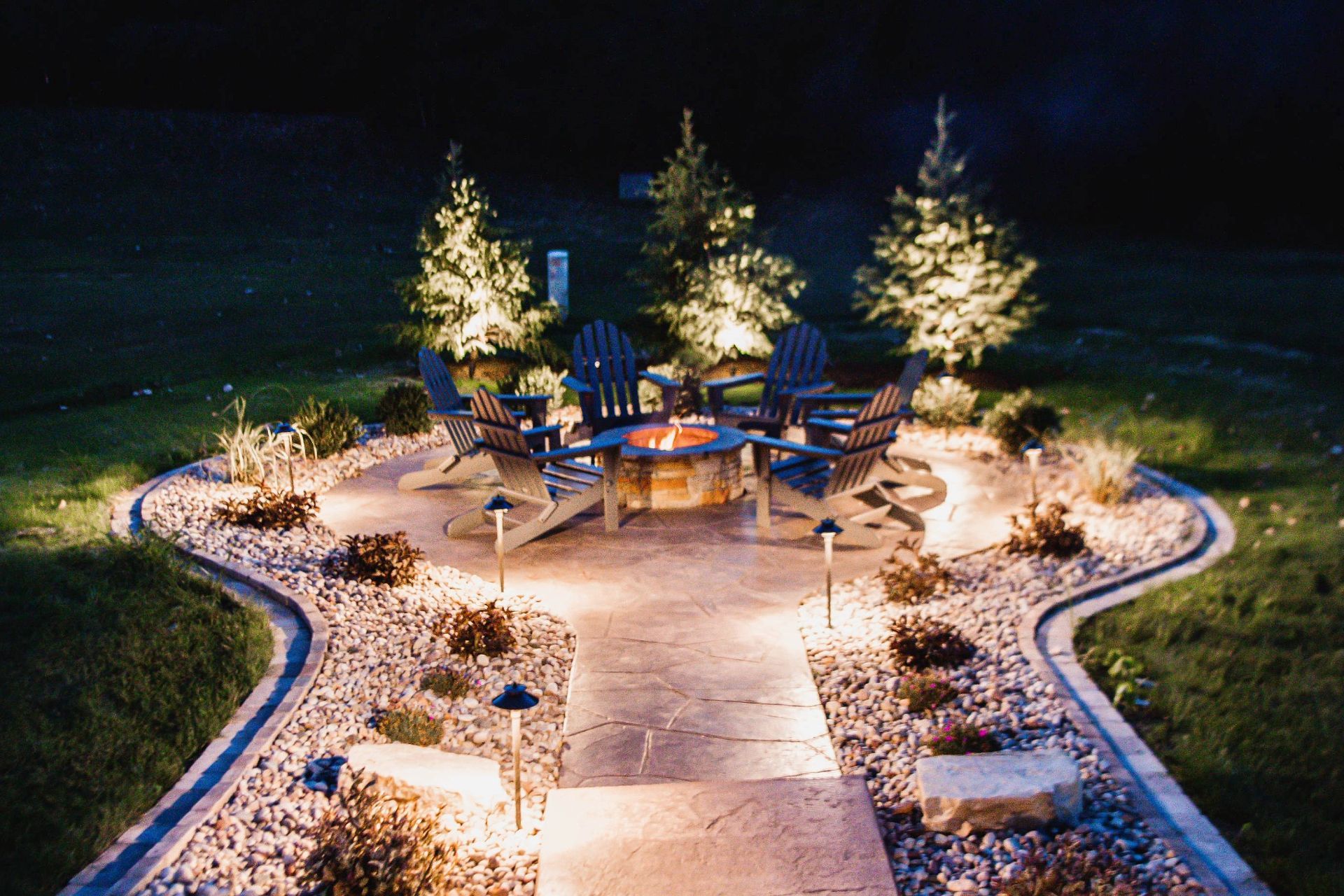 brick pavers with outdoor lighting and outdoor firepit