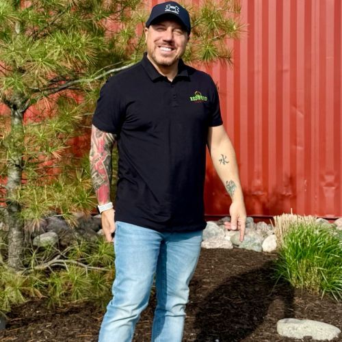 A woman in a red shirt Redwood Landscape employee Cedar Lake Indiana