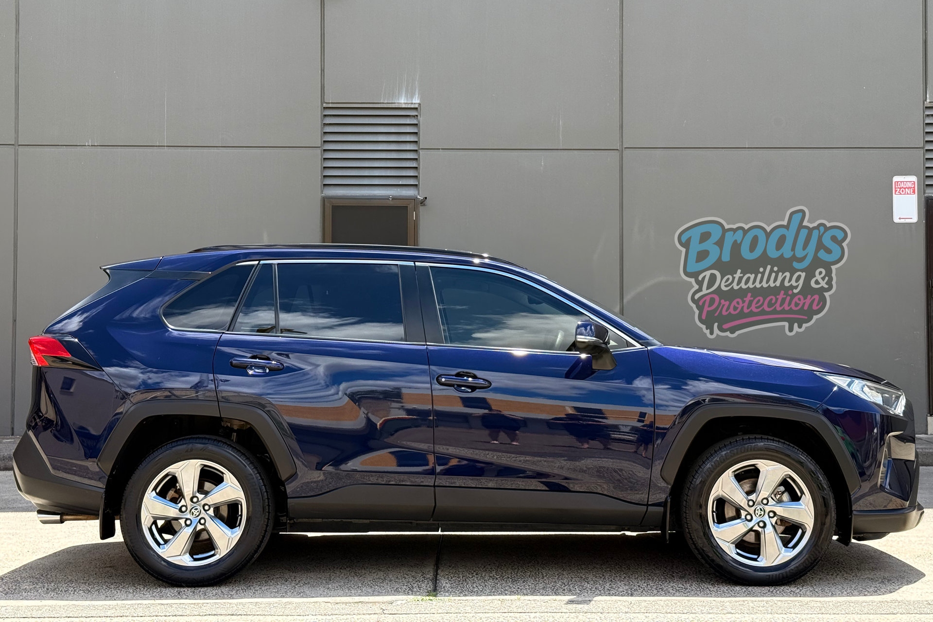 Blue Toyota RAV4 SUV parked outside, near a building with Brody's Detailing & Protection logo. — Brody’s Car Detailing In Tamworth, NSW