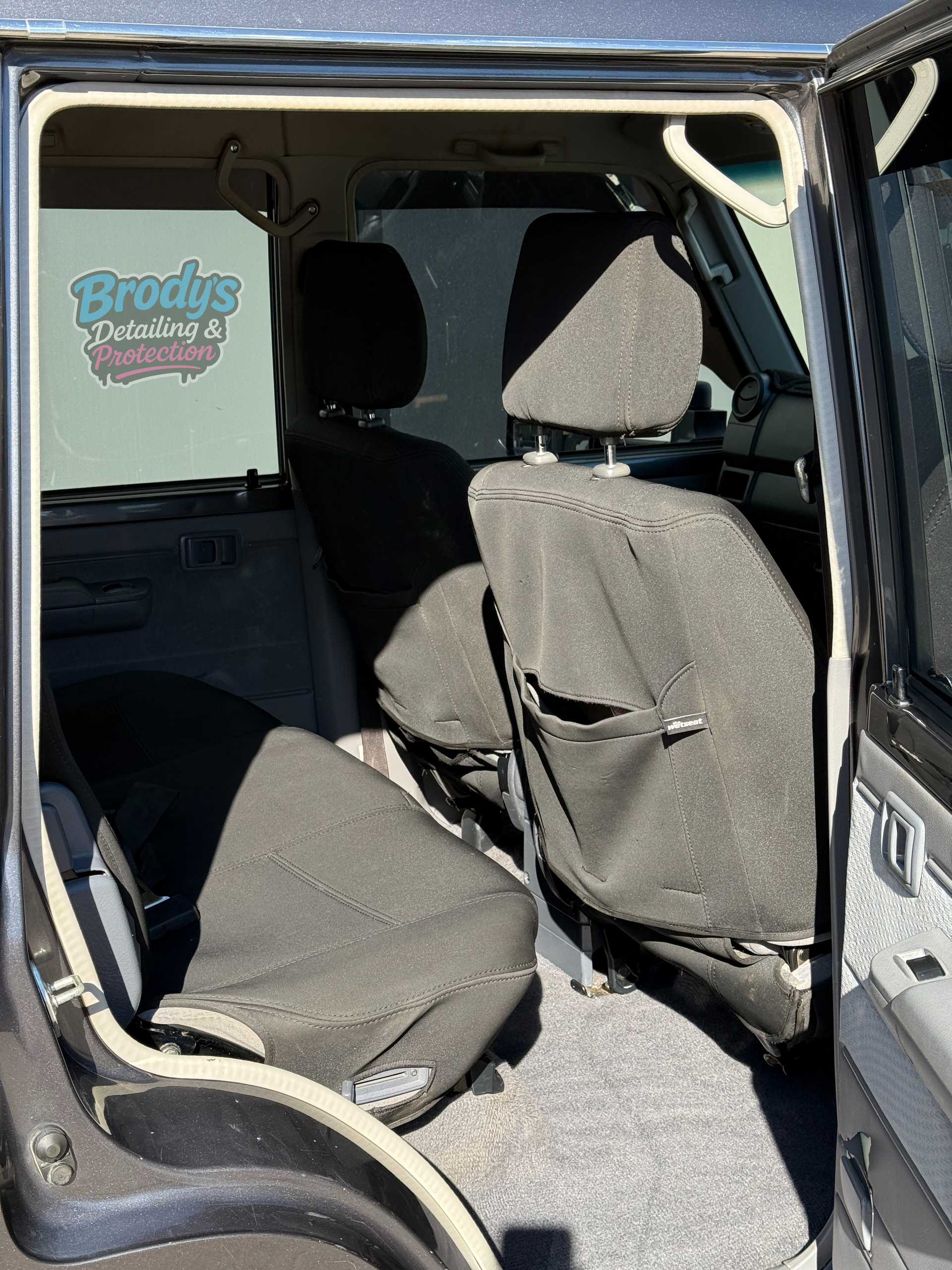 Interior View of a Vehicle's Back Seats With Black Seat Covers — Brody’s Car Detailing In Tamworth, NSW