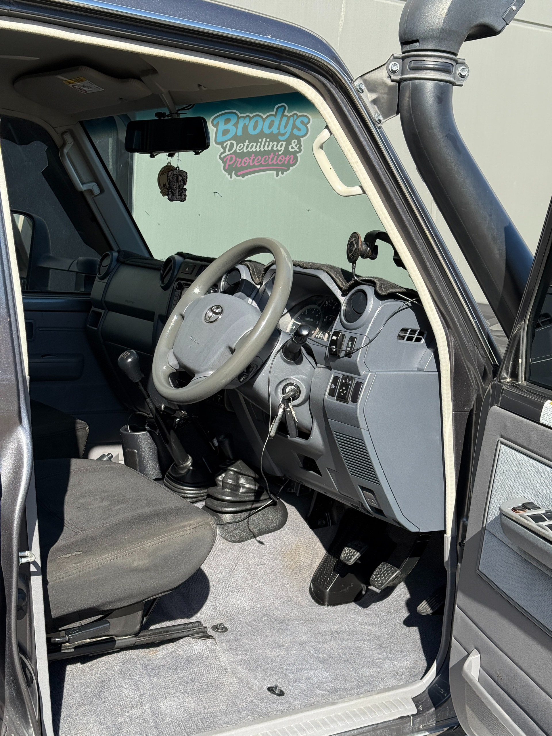 Grey Interior of a 4x4 Vehicle With Steering Wheel — Brody’s Car Detailing In Tamworth, NSW