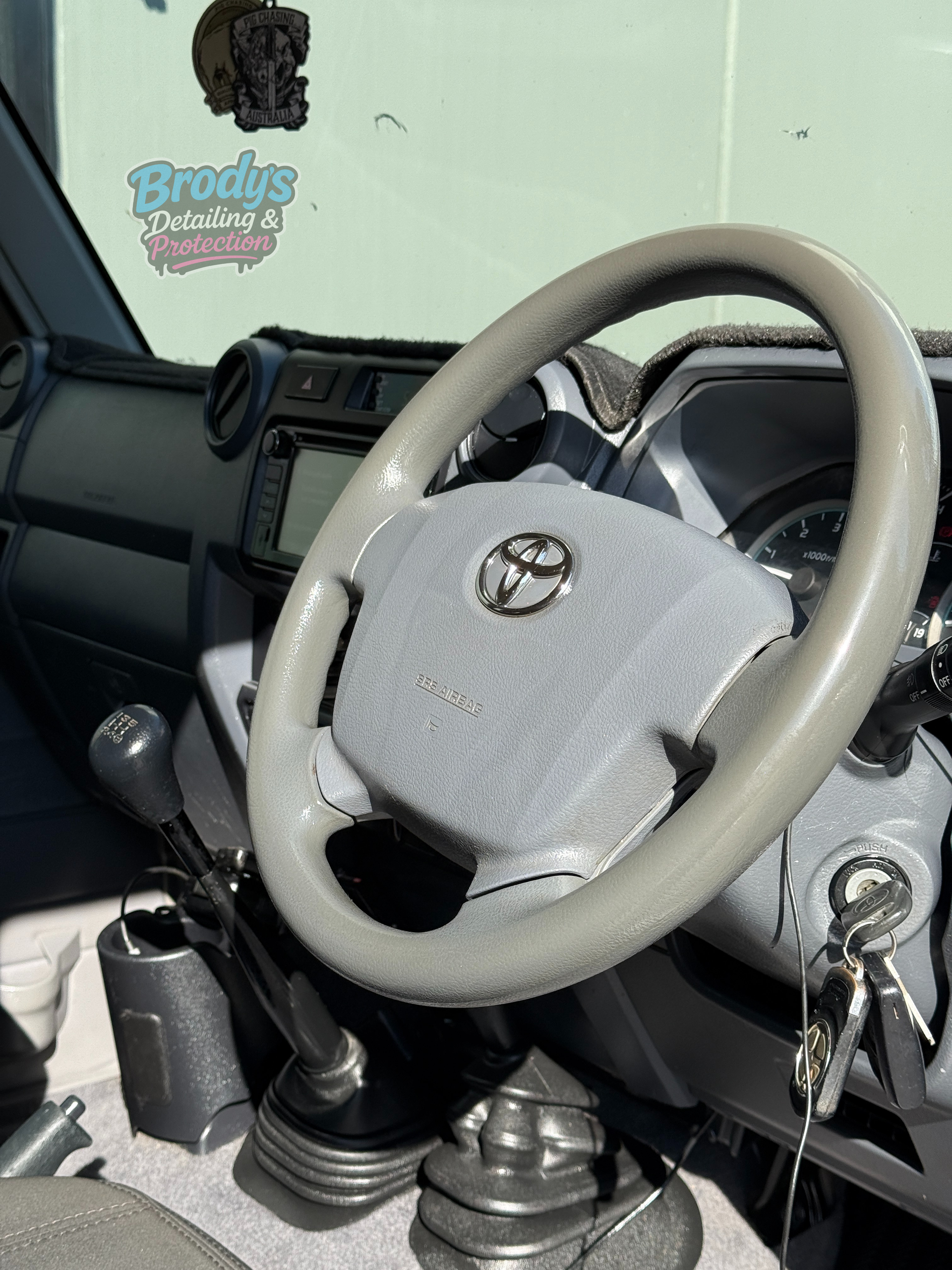 Grey Steering Wheel and Dashboard Inside a Toyota Land Cruiser  — Brody’s Car Detailing In Tamworth, NSW