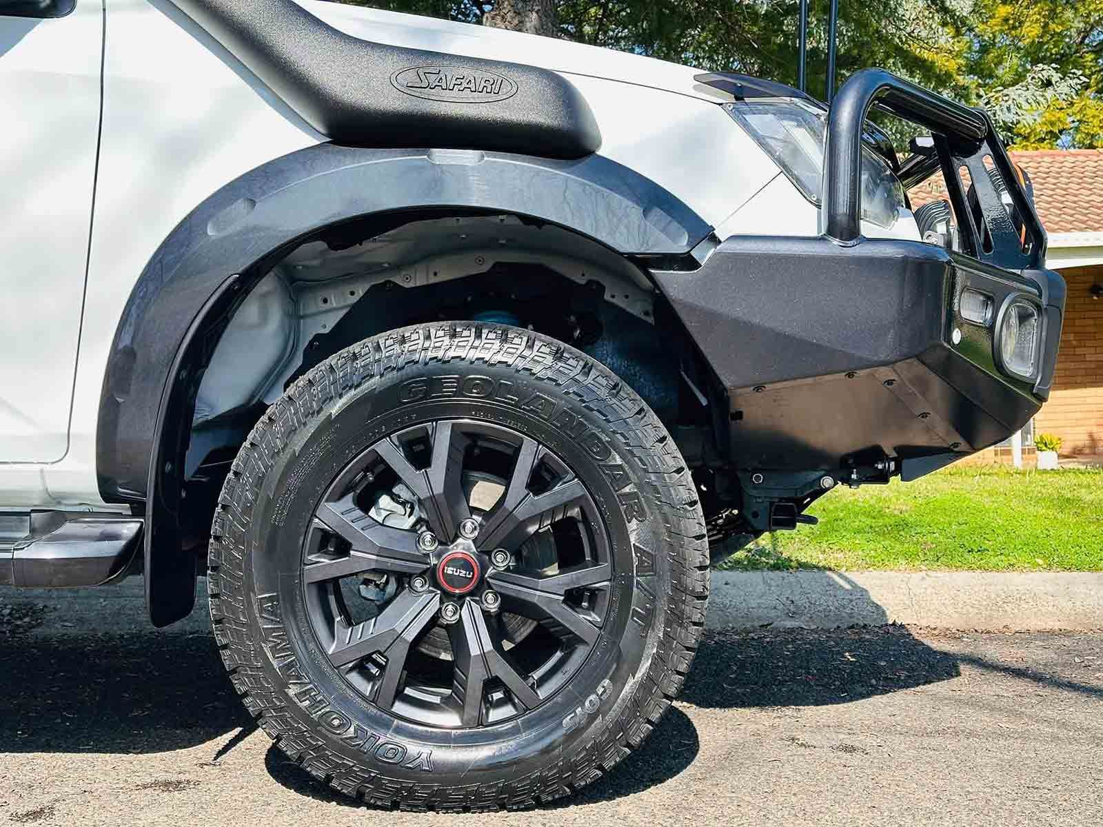 A White Truck With Black Wheels And Tires — Brody’s Car Detailing In Oxley Vale, NSW