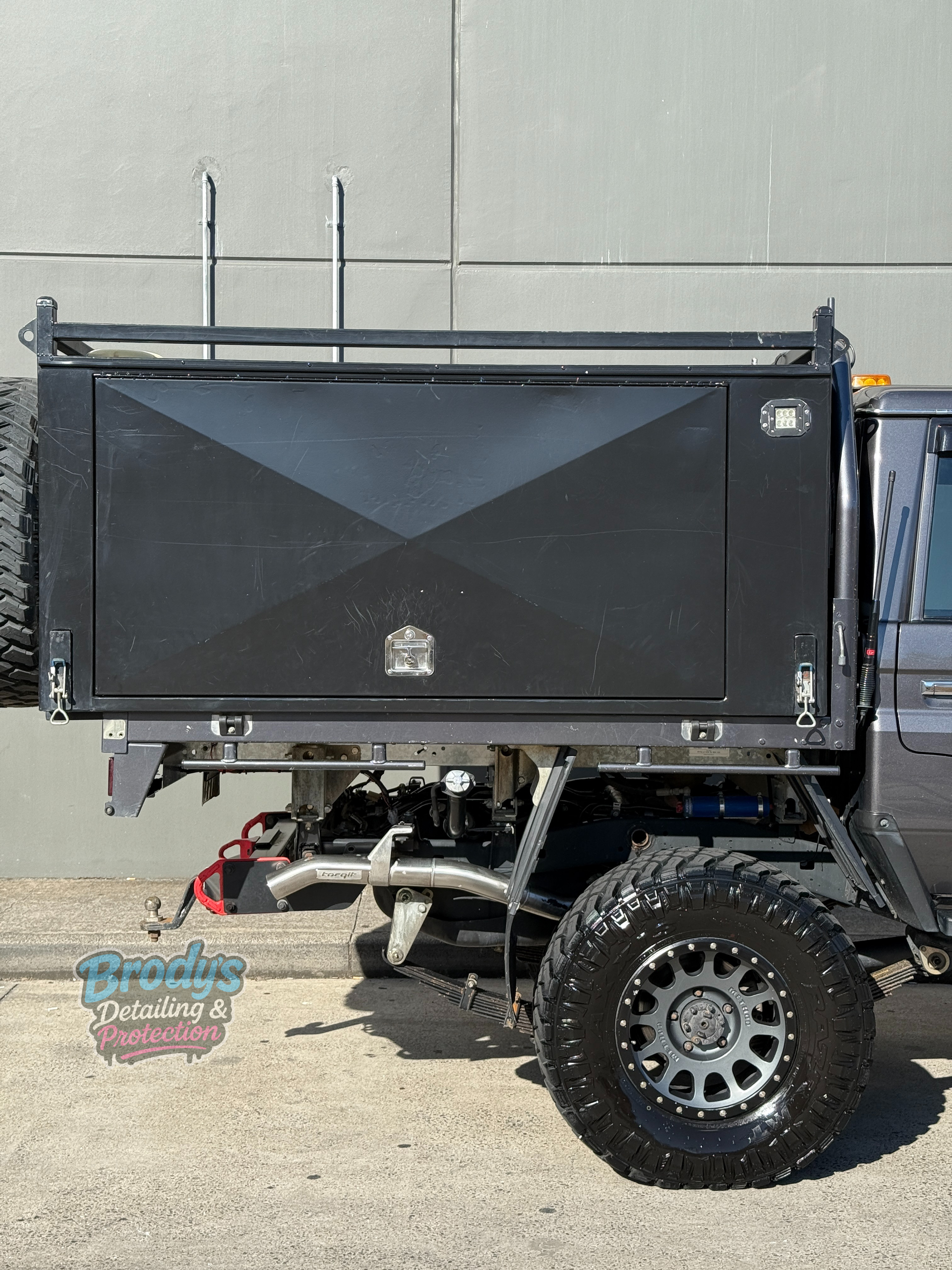 Black Pickup Truck With Large Tyres — Brody’s Car Detailing In Tamworth, NSW