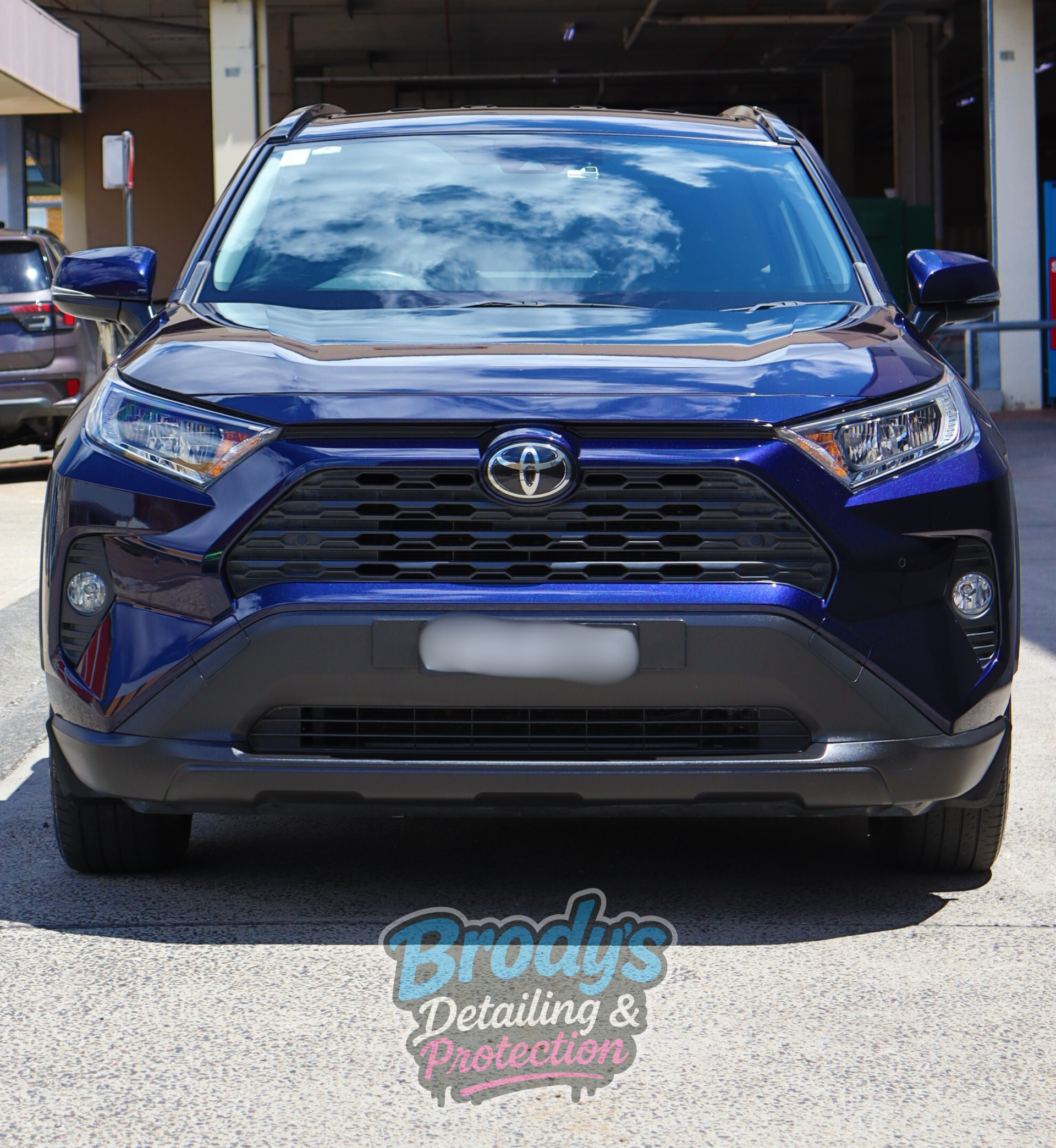 Blue Toyota RAV4 SUV parked in front of a building. — Brody’s Car Detailing In Tamworth, NSW
