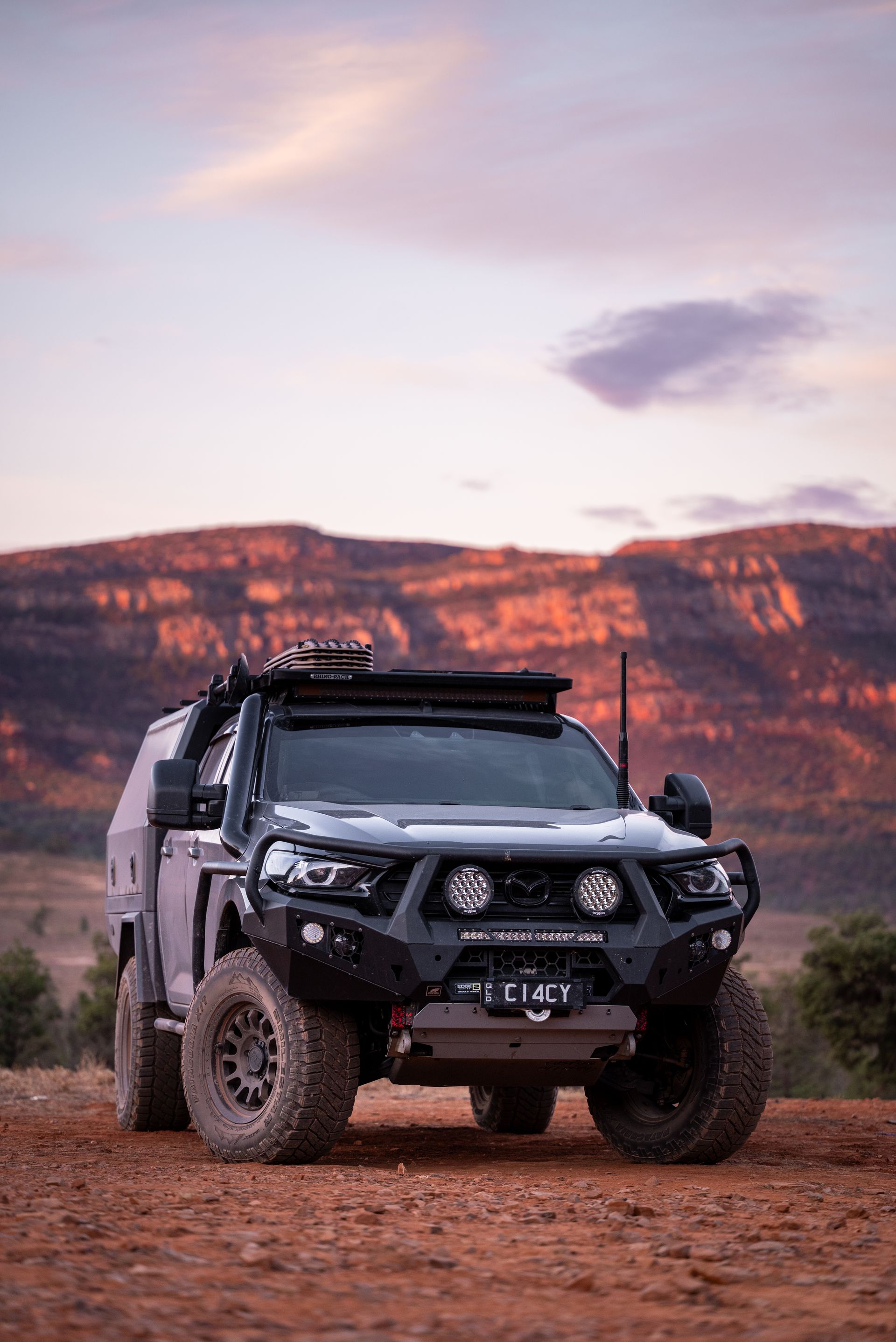 Modified Toyota Hilux truck in a desert landscape at dusk. — Brody’s Car Detailing In Tamworth, NSW