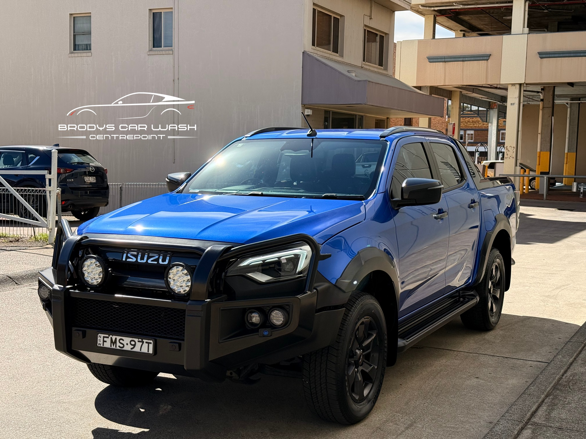 Blue Isuzu Pickup Truck Parked Outside — Brody’s Car Detailing In Tamworth, NSW