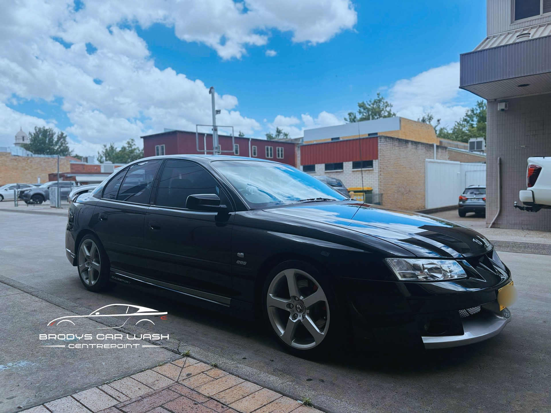 Black Sedan Parked on a Street — Brody’s Car Detailing In Tamworth, NSW