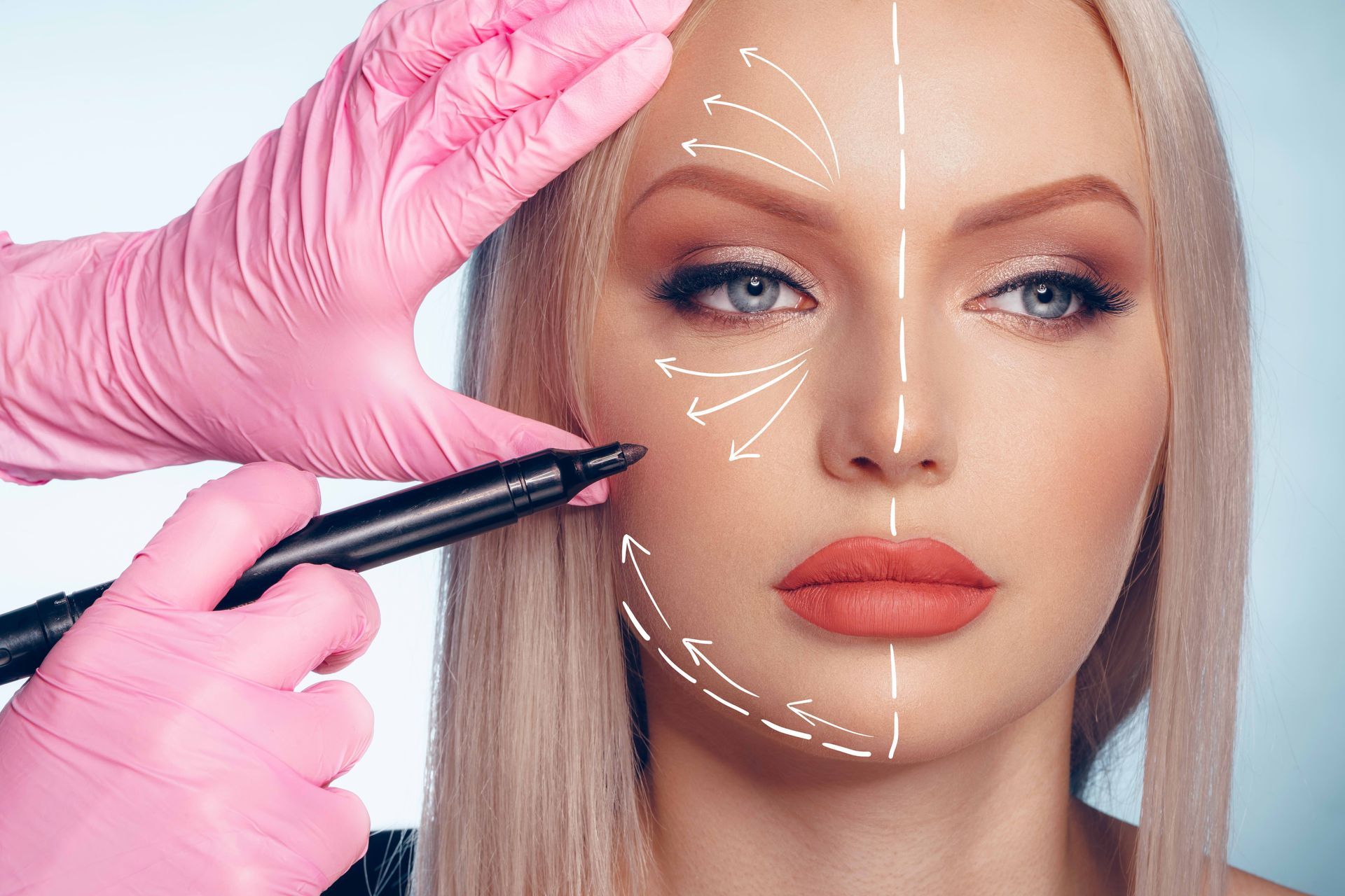 A woman is getting a plastic surgery on her face.