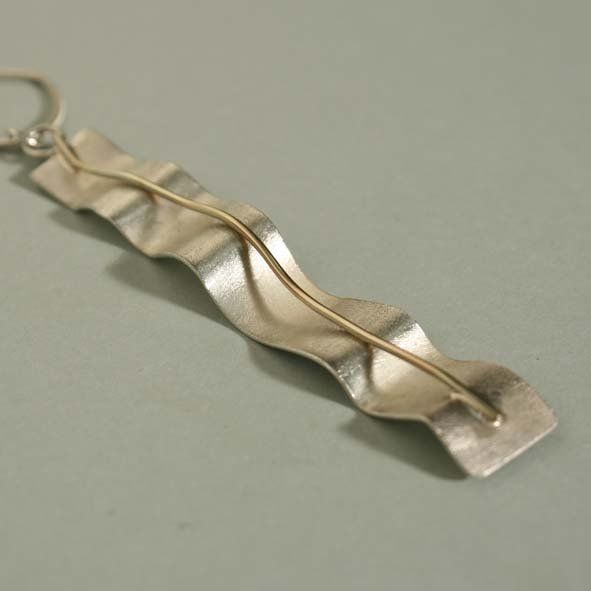 Flow pendant, gold and silver Maps silver, quartz, wood architectural pendant ©Libby Day Design