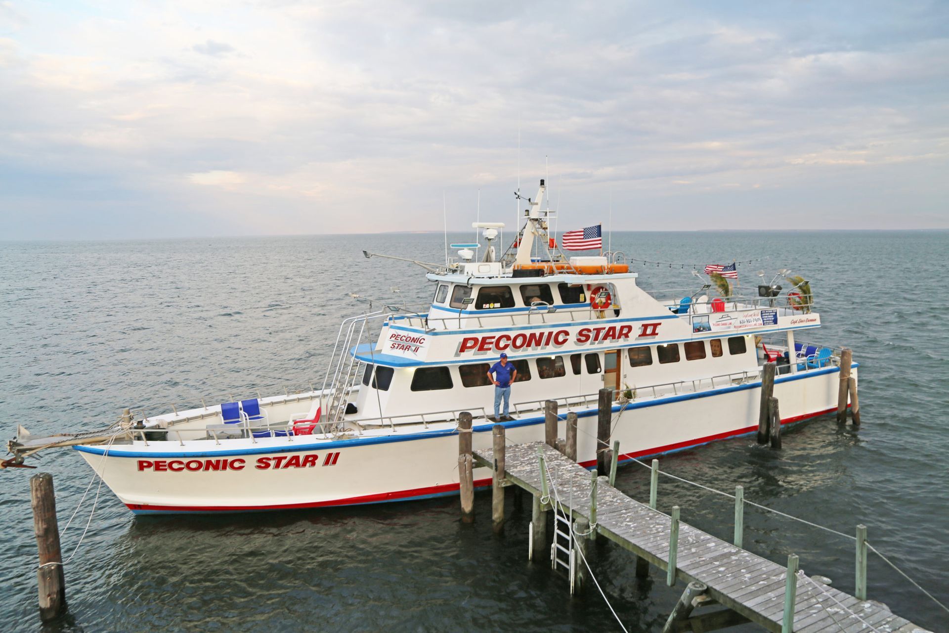 A picnic star boat is docked at a dock