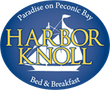 Logo for Harbor Knoll Bed & Breakfast. Blue oval with sailboat design and gold text on a blue background.