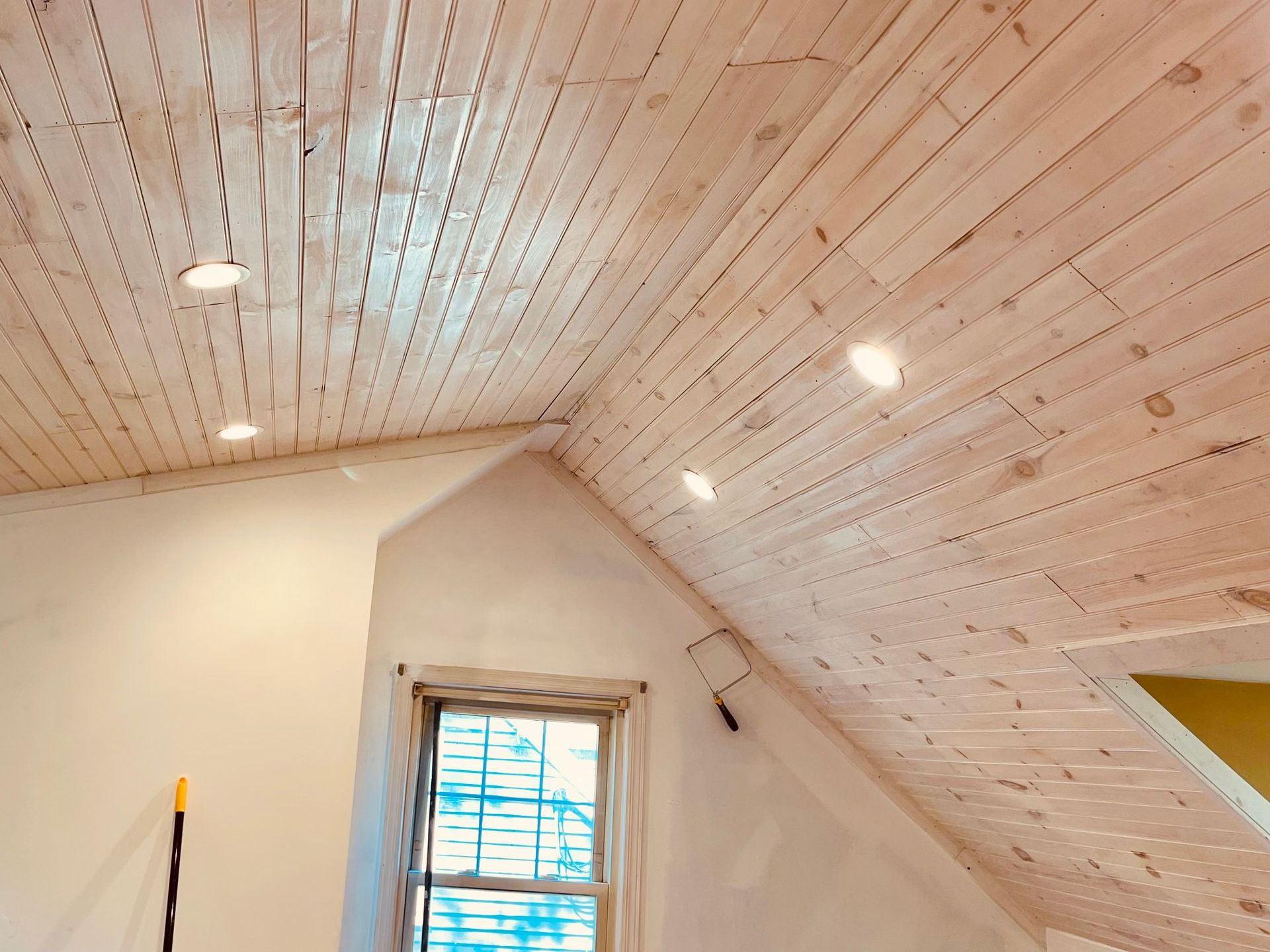 A room with a ceiling that is being built