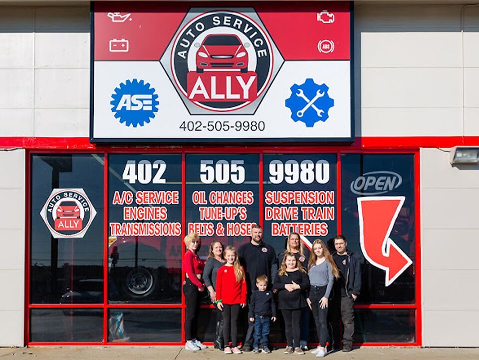 family pic near gate | Ally Auto Service