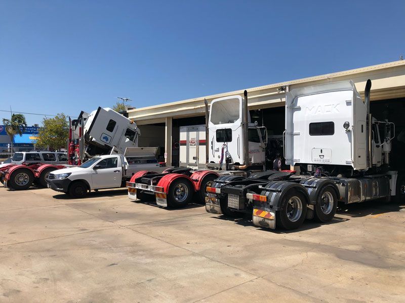 Parked Trucks — Townsville, QLD — Leslie's Auto Electrical & Air-Conditioning