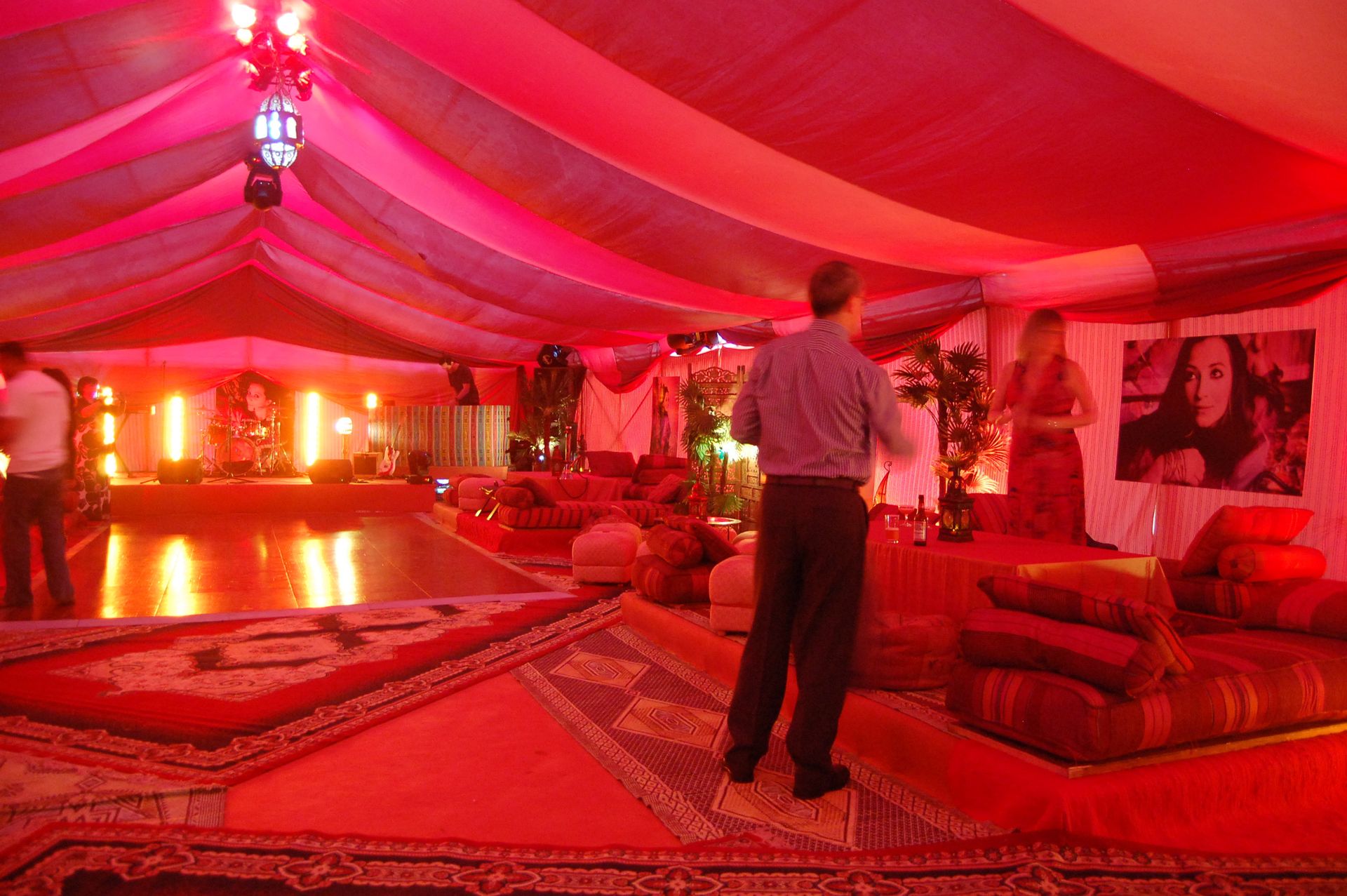 Arabian themed party with red and pink lights