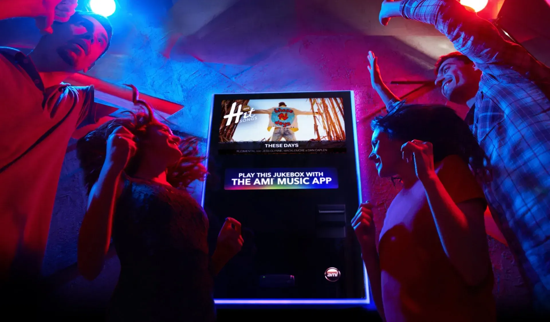A group of people are standing around a jukebox at a restaurant