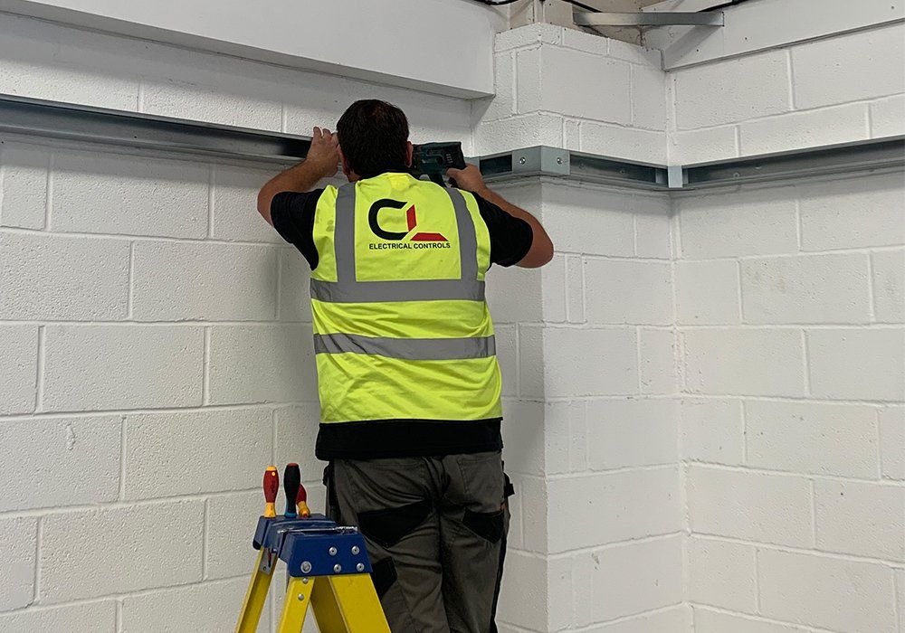 Closeup of electrician engineer works with electric cable wires of fuse switch box. Electrical equipment