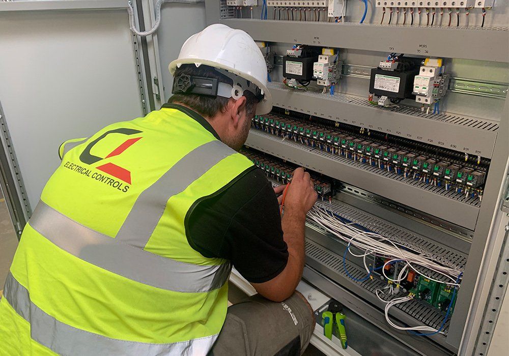 electrician testing industrial machine