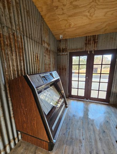 There is a refrigerator in the middle of the room.