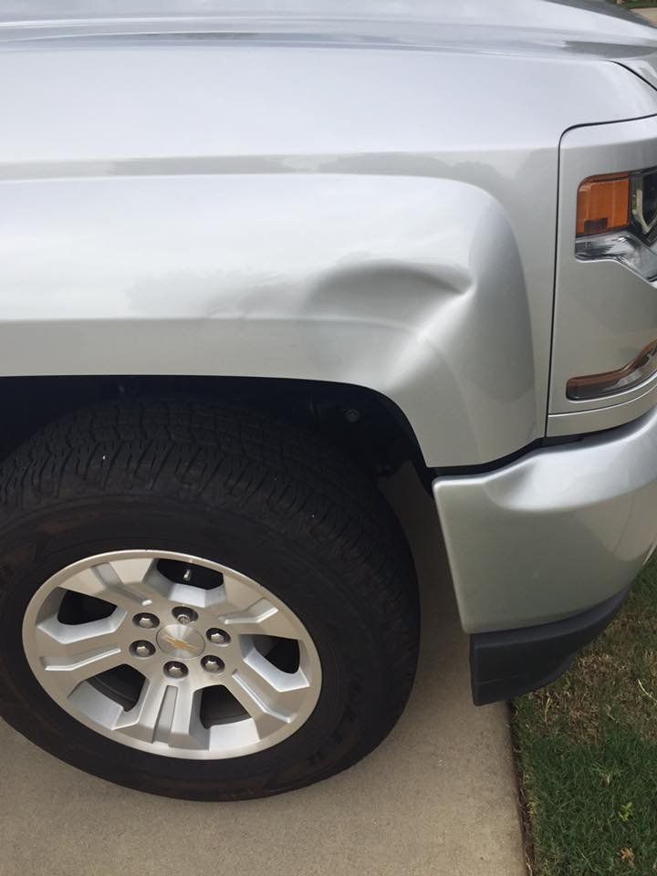 Dent Near The Car Wheel — Grovetown, GA — The Dentist Paintless Dent Repair