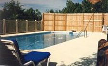 Pool With Wooden Fence - Meriden, KS - Four Seasons Pools