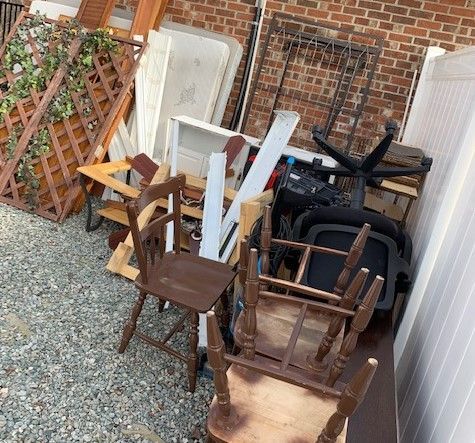 A garage filled with lots of boxes and bicycles.