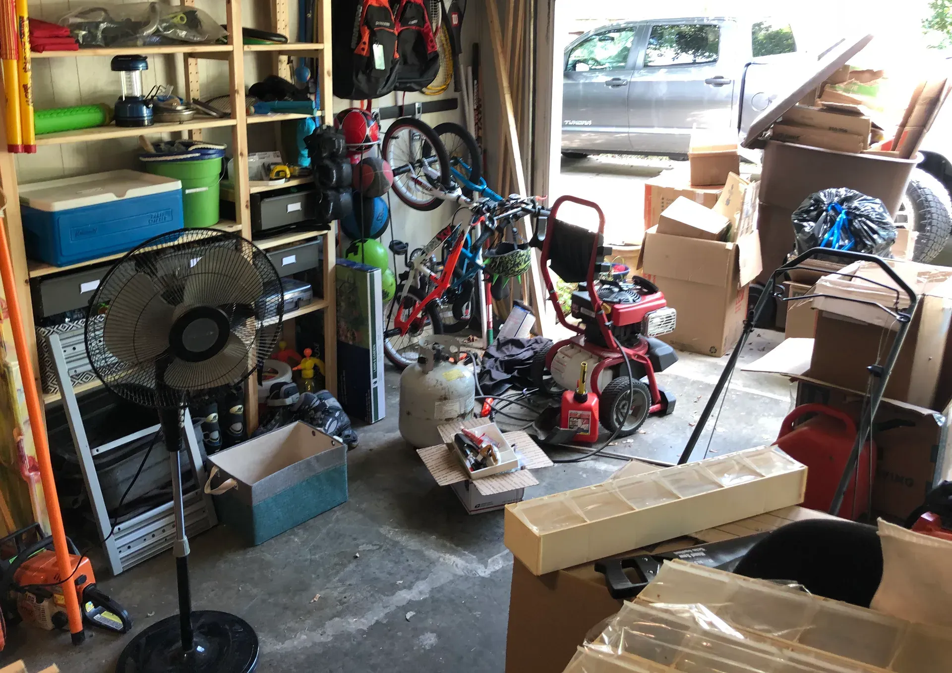 A garage filled with lots of tools and boxes.