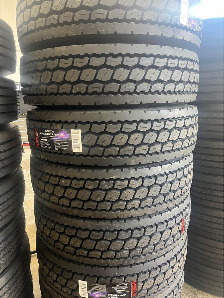 A pile of tires are stacked on top of each other.