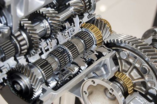 A close up of a gearbox with a lot of gears