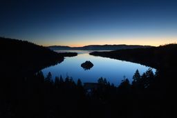 Scenic view of Lake Tahoe surrounded by mountains, reflecting on a personal story about growing up a