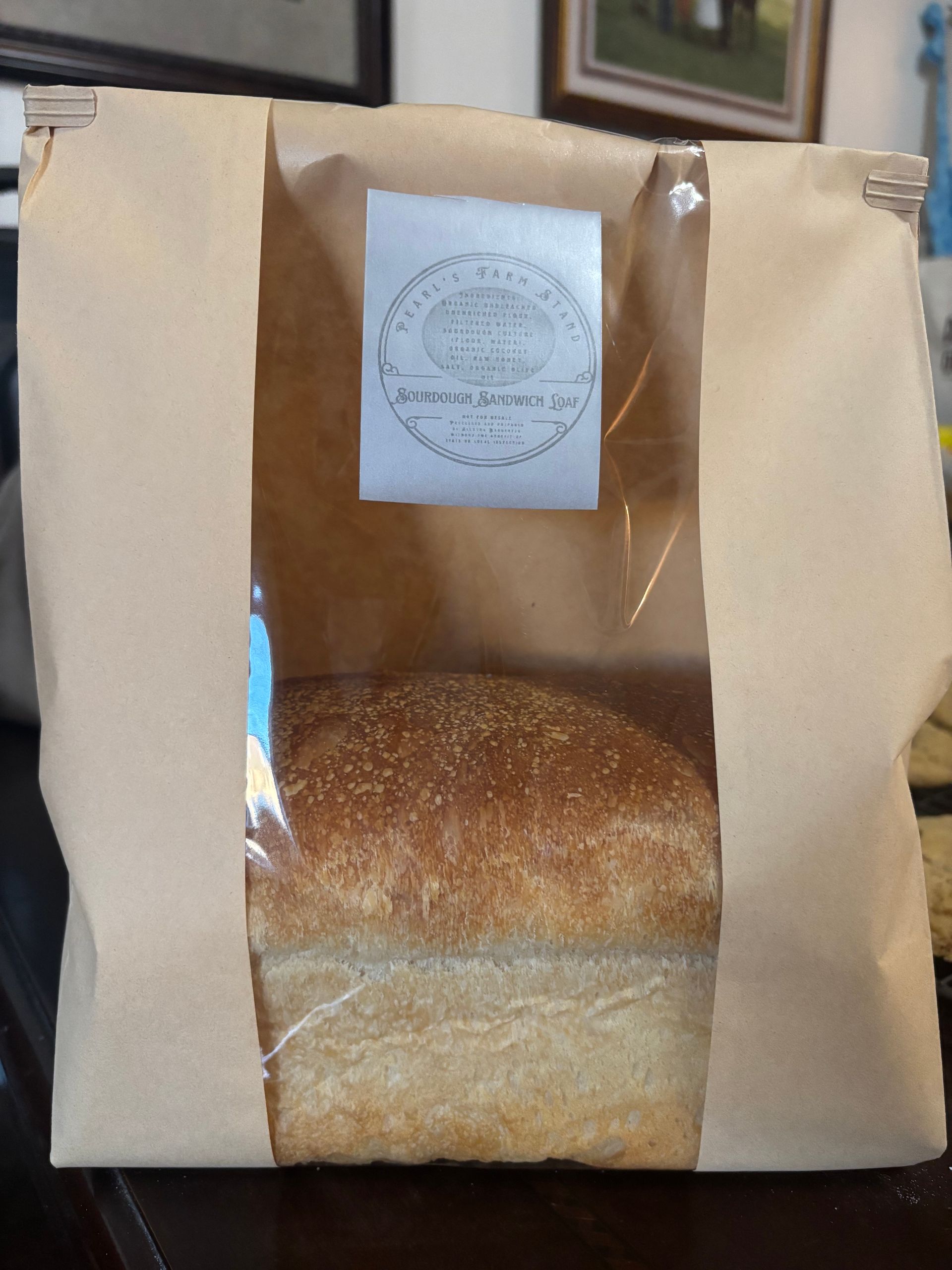 Lush green lawn with manicured rows, leading to red rock mountains under a clear blue sky in Sedona, Arizona.