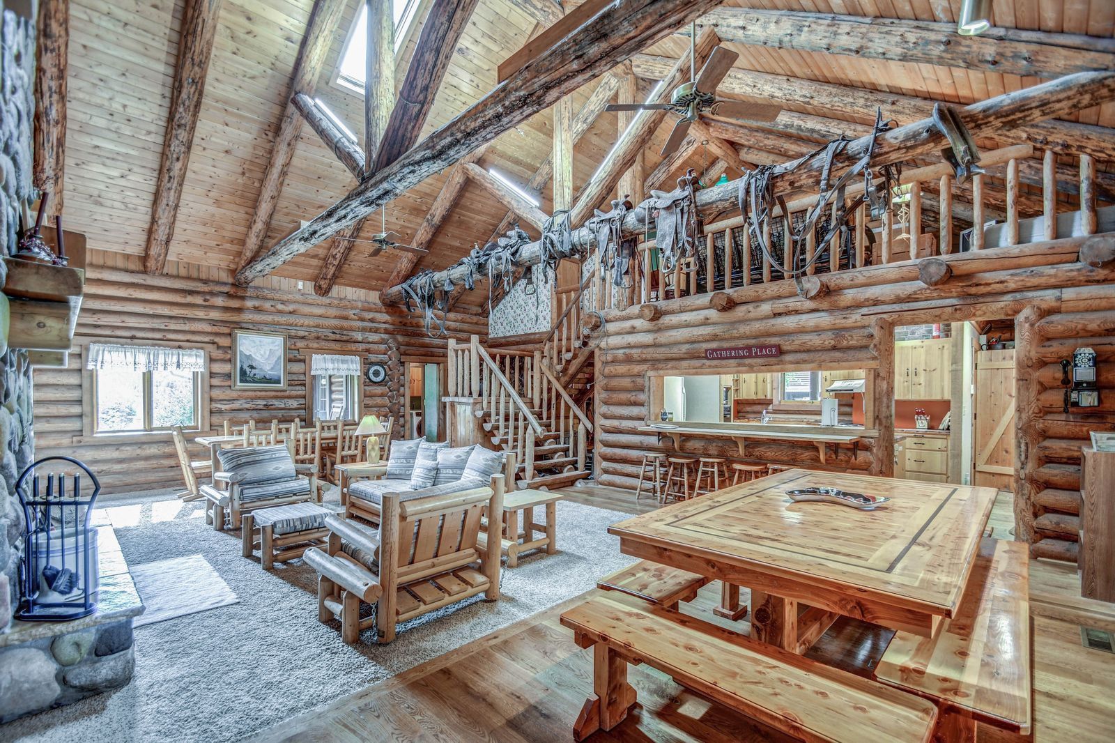 Rustic cabin in desert landscape with red rock mountains at sunset.
