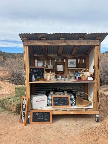 Lush green lawn with manicured rows, leading to red rock mountains under a clear blue sky in Sedona, Arizona.