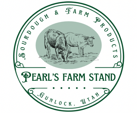 A wooden farm stand displays vegetables, cheeses, and jars of ranch dressing.