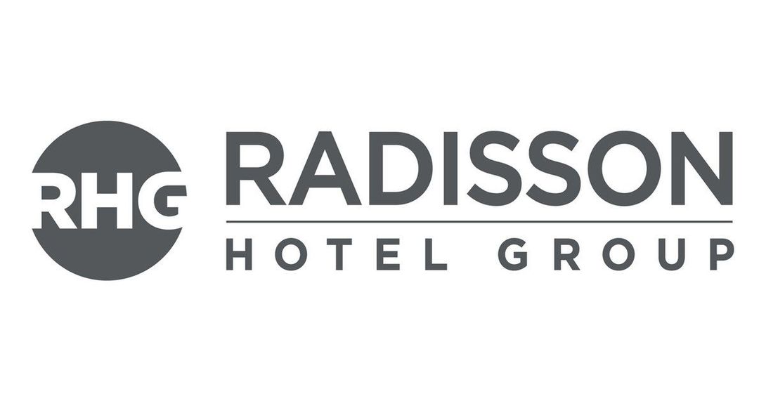 The logo for radisson hotels is on a white background.