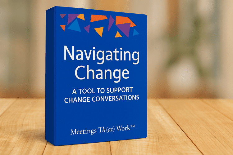 Blue book titled "Navigating Change." Text: "A tool to support change conversations." Wooden table.