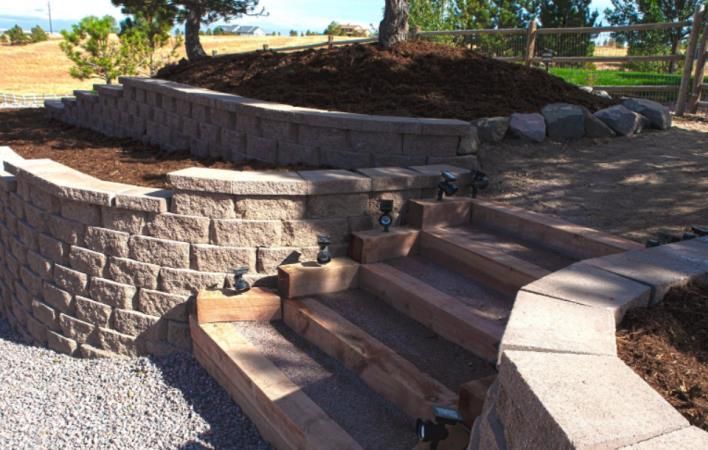 a stone wall with stairs leading up to it