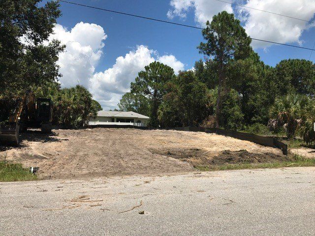 Grading Services — Lot Cleared in Front of a House in Punta Gorda, FL