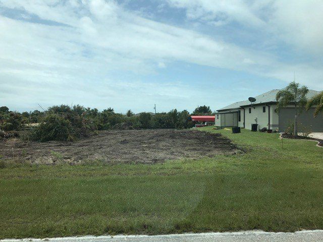 Land Clearing Service — Land Clearing beside a House in Punta Gorda, FL