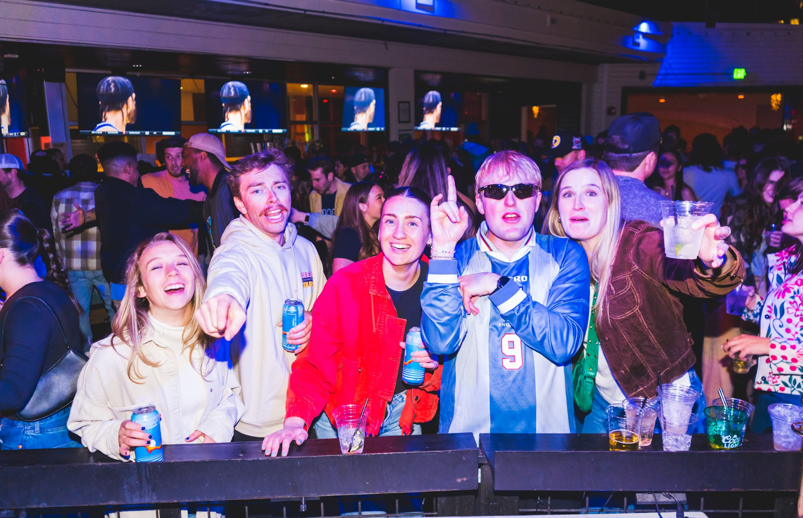 A group of people are posing for a picture in el patio in denver colorado