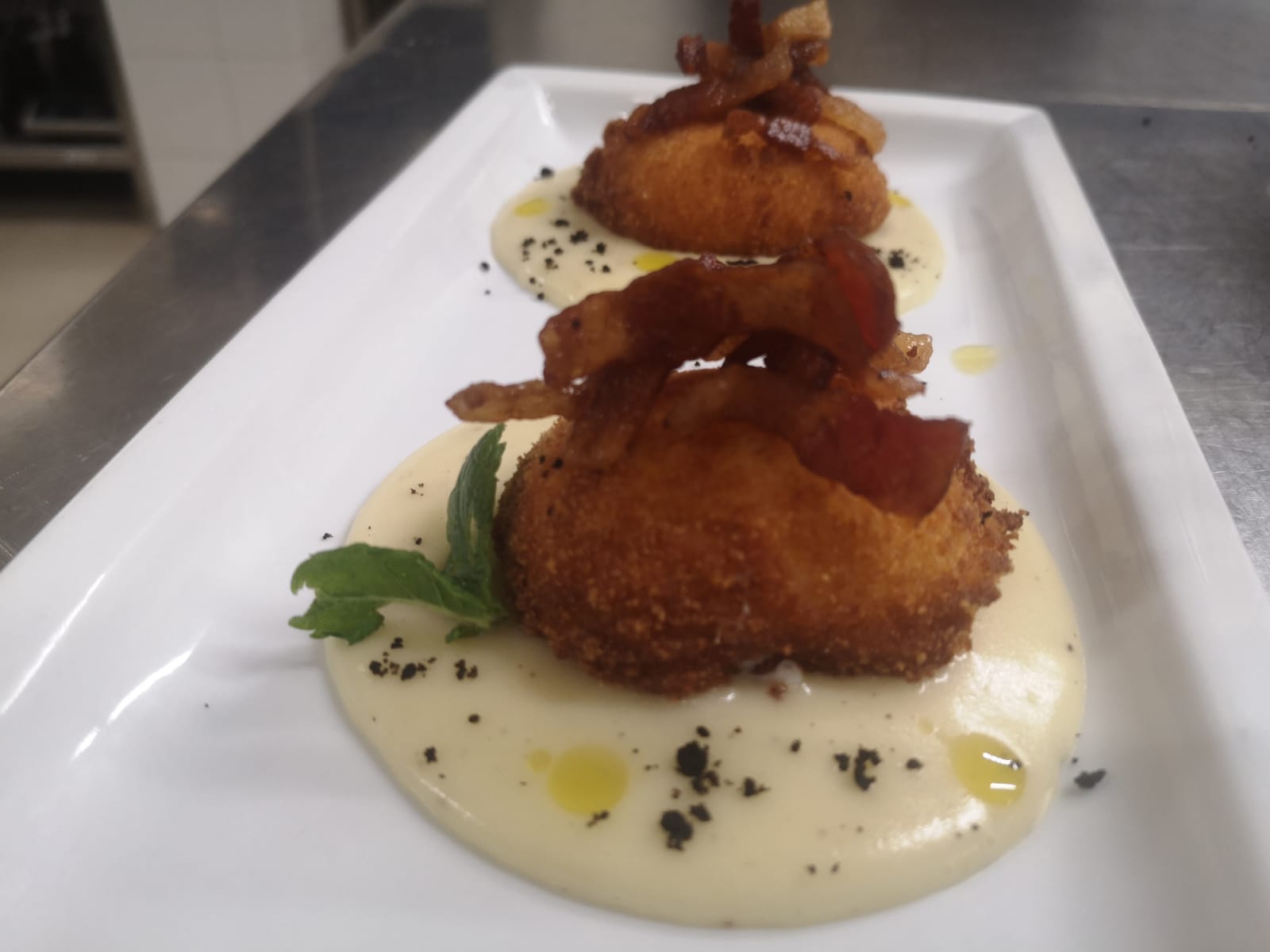 croquettes garnished with crispy bacon