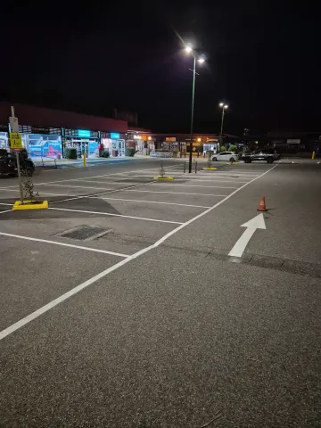 Line marking car park bays and straight arrow, Healsville coles 